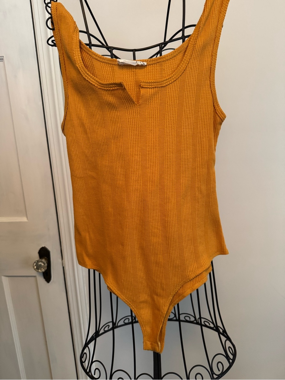Sleeveless Ribbed Bodysuit in Mustard Yellow